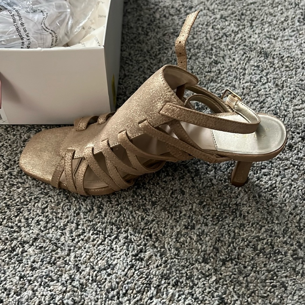 Never worn heels. Gold shimmer color. Small heel